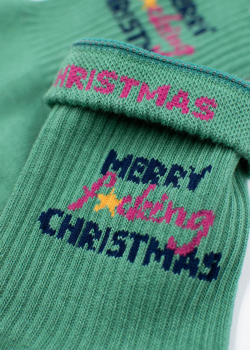 Weihnachtssocken "Merry fucking X-Mas" von J. Clay für Frauen und Männer