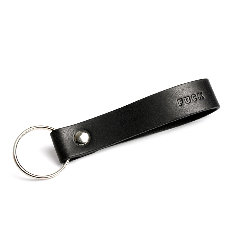 Schwarzer Schlüsselanhänger mit Aufschrift "Fuck"