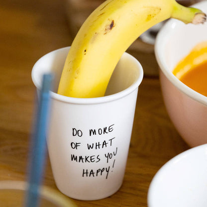 Tasse "Do more of what makes you happy!" aus Porzellan von helen b.