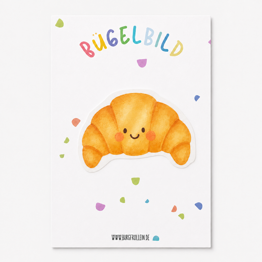 Bügelbild „Croissant mit Gesicht" (A6) im Aquarellstil zum Aufbügeln auf Shirts, Pullover oder Kita-Beutel – süßes Geschenk für kleine Frühstücks-Fans