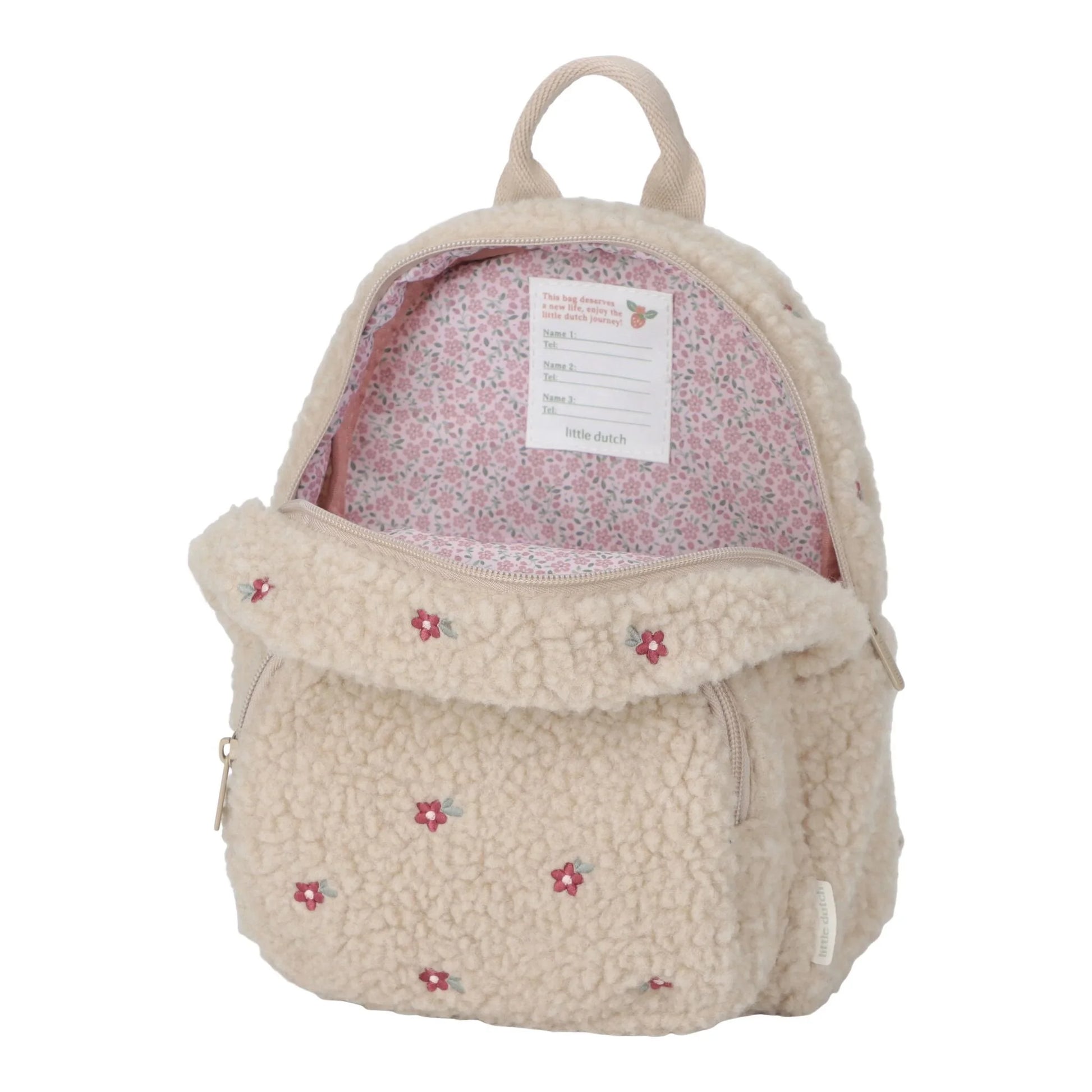 Little Dutch Teddy-Rucksack „Sand“ geöffnet – Innenansicht mit rosa Blumen-Innenfutter und Namensschild, Kinderrucksack aus weichem Teddyplüsch in Beige