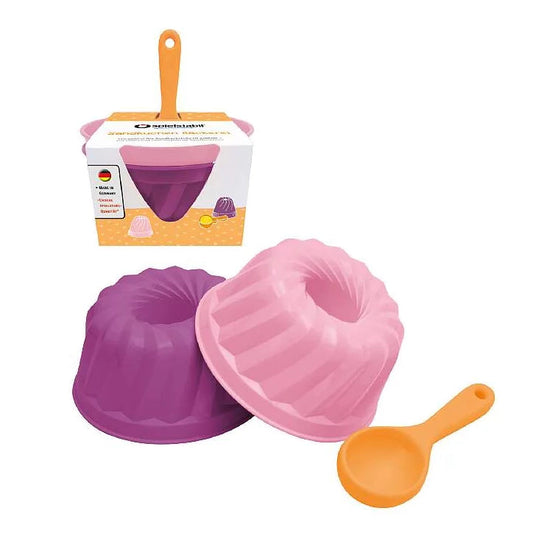 3-teilige Sandkuchen Bäckerei Sunsetpop von Spielstabil mit lila und rosa Sandförmchen, orangefarbenem Löffel und Verpackung