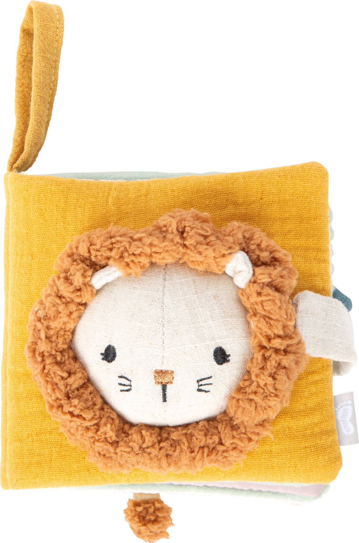 Coverseite des Fühlbuchs „Little Lion" von Small Foot mit großer Löwenkopf-Applikation, flauschiger Mähne und Aufhängeschlaufe auf senfgelbem Mulltuch – Babyspielzeug zur Förderung der Sinne ab 0 Monaten