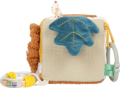 Spielwürfel „Little Lion" von Small Foot mit blauem Plüsch-Blattmotiv und gelber Stickerei auf beigem Stoff, seitlichem Greifring und transparenter Rassel mit bunten Kugeln – Babyspielzeug zur Förderung der Sinne ab 0 Monaten